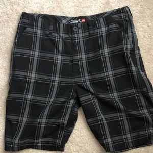 Black and grey quicksilver shorts, 34 in waist.